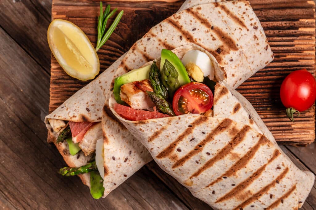 Where to Find the Best Grilled Wrap in Clayton – Tiffin Box’s Irresistible Indian Fusion Wraps 2 burritos wraps with asparagus cherry tomatoes av 2025 01 10 15 17 20 utc